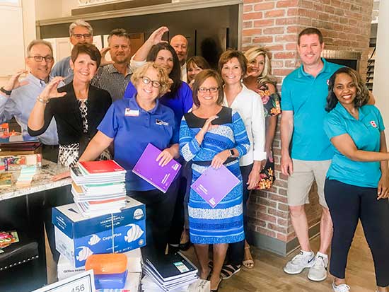 The Team in Indianapolis celebrate another successful School Supplies Drive, with donations going to Teachers’ Treasures.