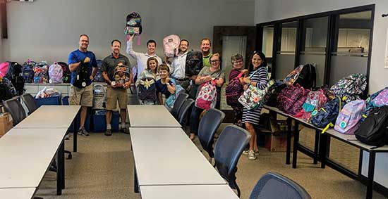 Communities in Schools of Wake County received more than $9,600 in supplies, including many backpacks, from the Raleigh Team.