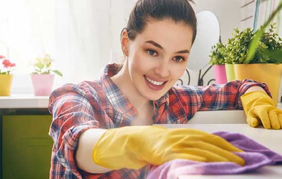 woman cleaning countertop