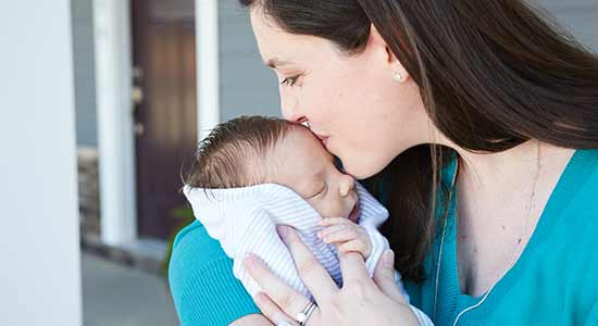 woman holding baby