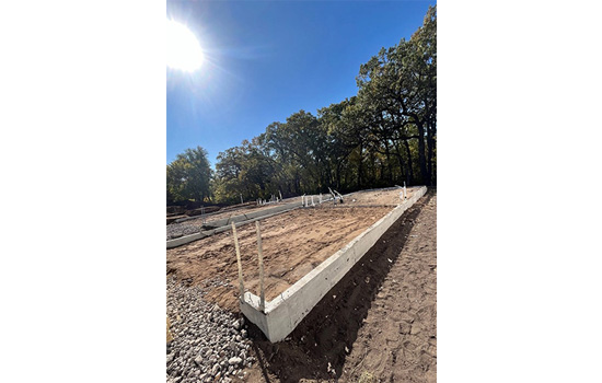 A David Weekley Home during the first step of home construction: preparing the lot and foundation