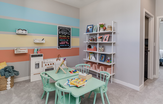 A decorated kids’ playroom with toys in a David Weekley model home in South Jordan, UT.