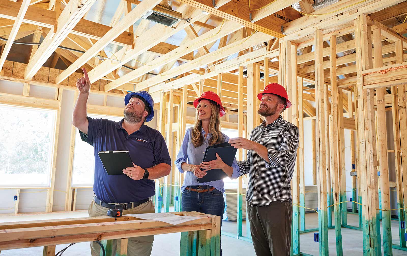 Two David Weekley homebuyers ask their builder questions about the construction quality of their home from inside their unfinished new construction home. 