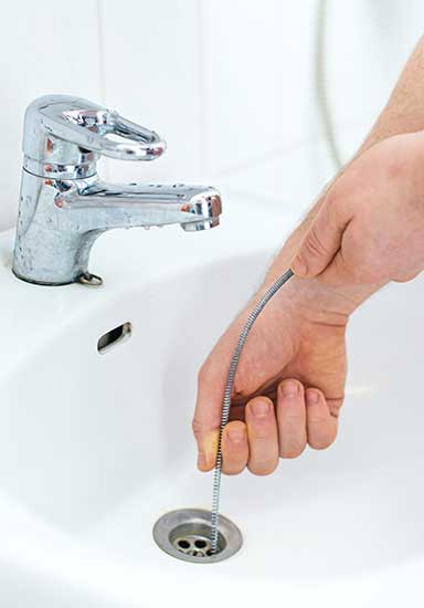 snaking out a drain