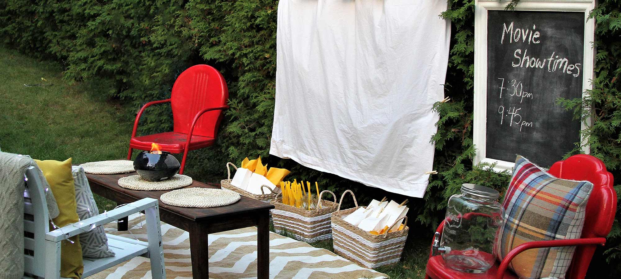 backyard movie set up with lawn chairs