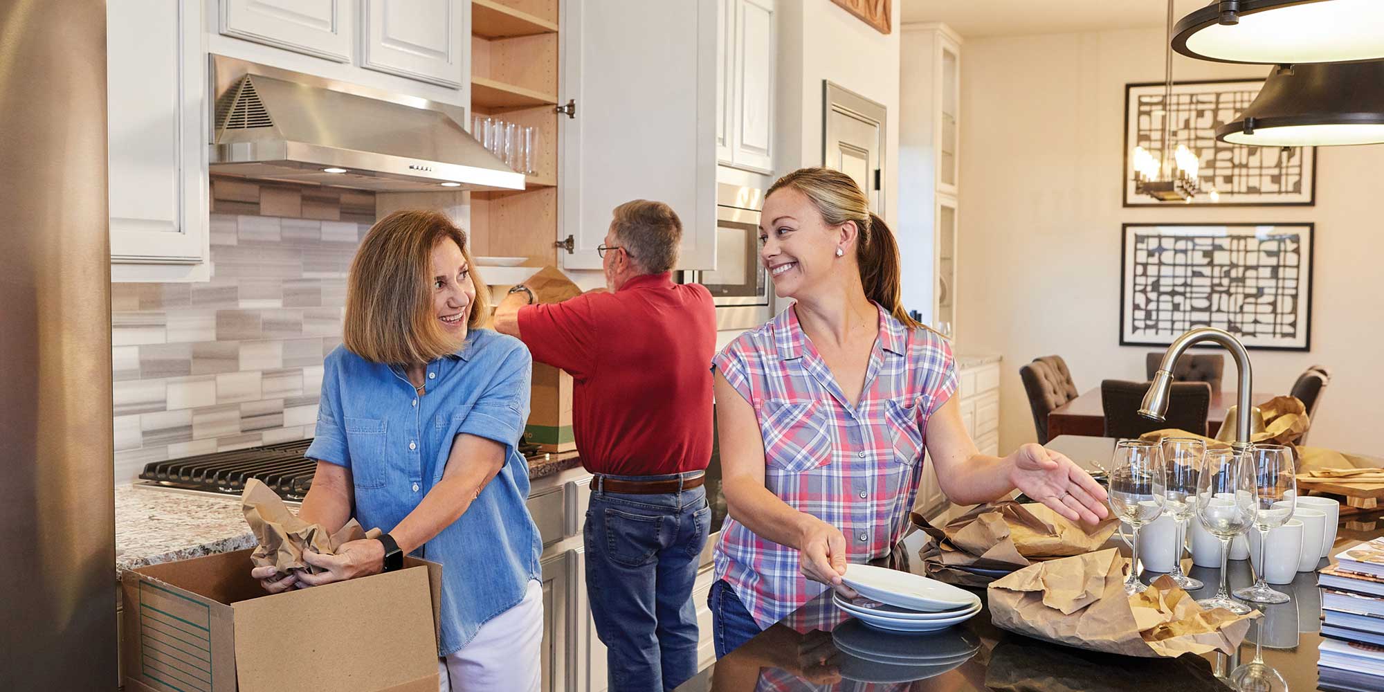 family moving into kitchen