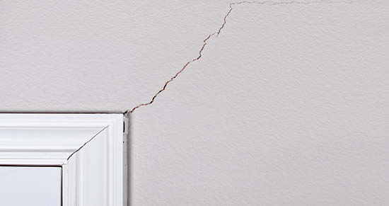 cracked sheetrock and door frame