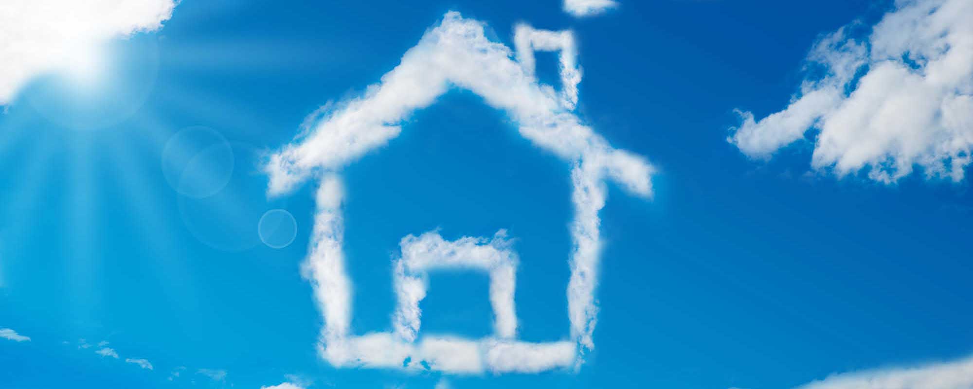 blue sky with clouds in the shape of a home