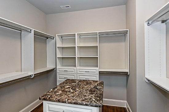 closet with island in it