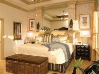 bedroom with a large mirror on the headboard.